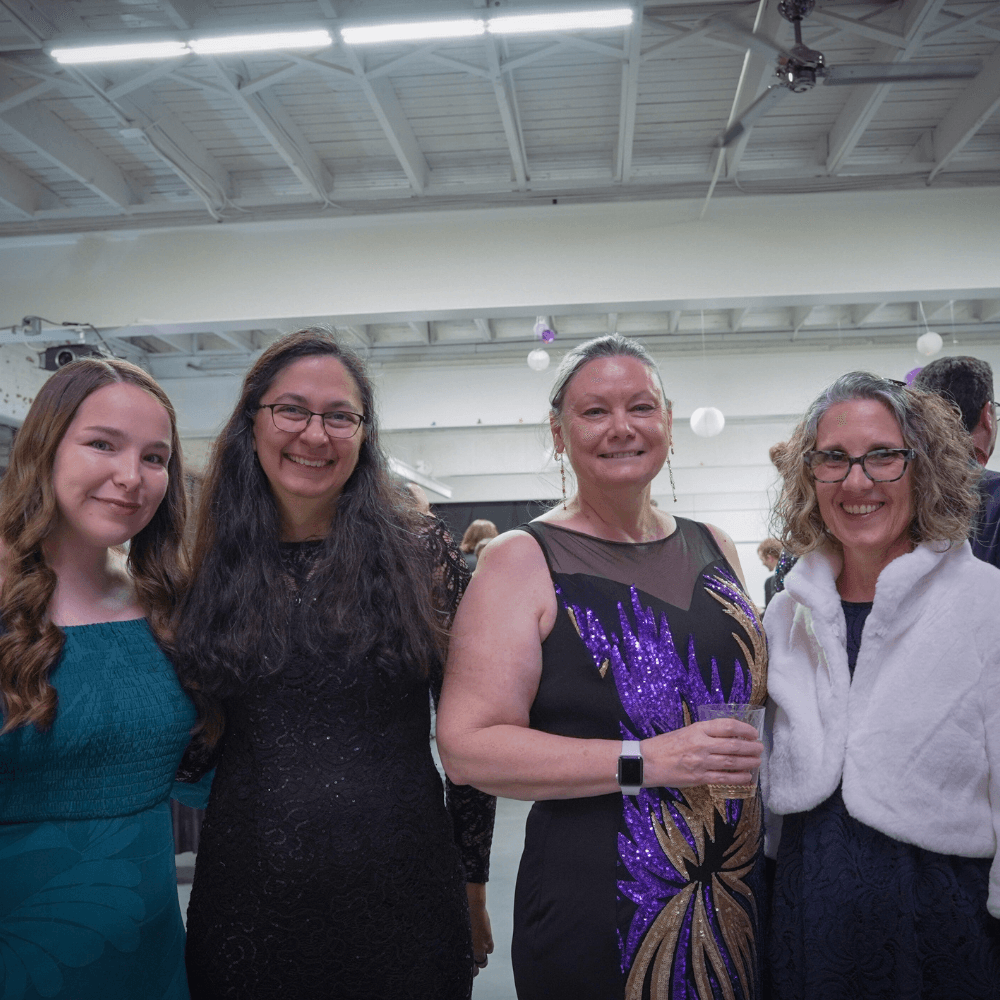 cirila with the nonprofit MAGIC's staff at a gala event.